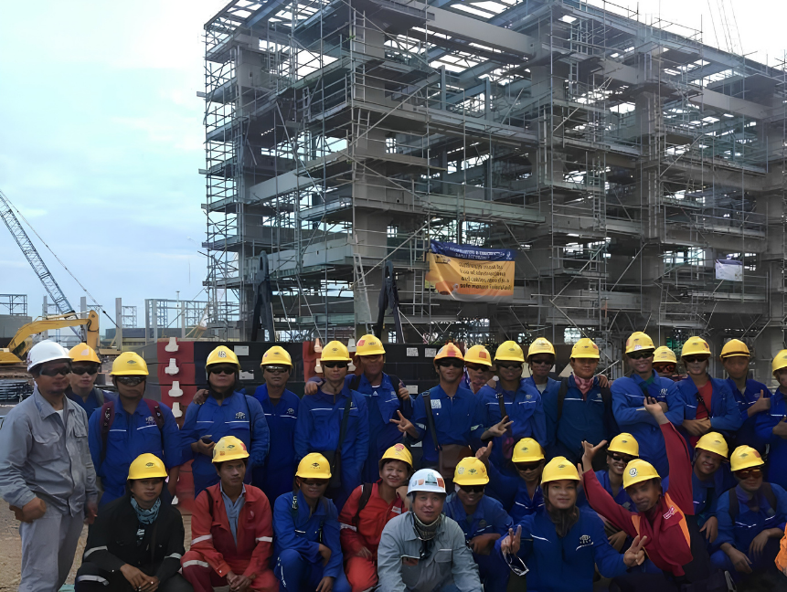 Kiwi Engineering day shift crew in front of a scaffolded steel structure